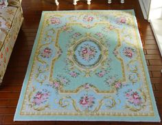 a living room with a rug on the floor