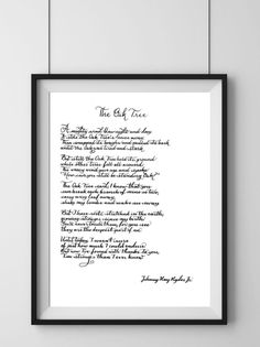 a framed black and white photograph with the words,'the old tree'written in cursive writing