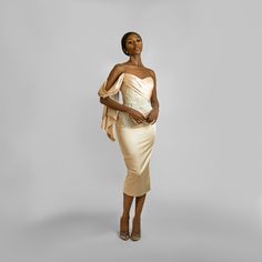 This Lovely draped off-the-shoulder dress comes with a sweetheart neckline, pleated panel at chest going down to the waist, then joined by beautiful hand beaded embroidery around the waist area. The White details on this piece are a combination of Pearls and sequins fixed by hand to perfection. With a Midi penciled silhouette, you’ve got room to show off your pretty shoes. Pair this dress with a single strap high heeled sandals and you are good to go. Dry Cleaning Only Off-shoulder Pre-draped Evening Dress With Ruched Bodice, Elegant Off-shoulder Ruched Corset Dress, One-shoulder Fitted Bodice Off Shoulder Dress For Gala, Glamorous Off-shoulder Dress With Ruched Bodice, Elegant Off-shoulder Dress With Ruched Bodice For Parties, Off-shoulder Dress With Fitted Bodice For Evening, Off-shoulder Corset Dress With Ruched Bodice, Elegant Off-shoulder Ruched Dress, Off-shoulder Silk Evening Dress