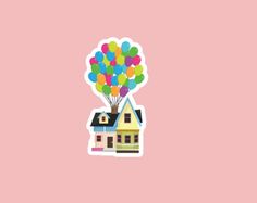 a house with balloons flying over it