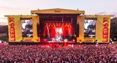 a large group of people standing on top of a stage