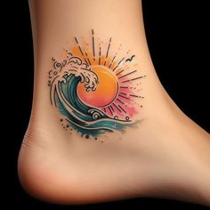 a tattoo on the foot of a woman with an ocean wave and sun in the background