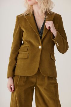 This double pocket blazer is the epitome of cool. Cut similarly to our classic Bianca Blazer, the Tilda is a little shorter for a slightly shrunken silhouette. In our crisp yet supple cotton corduory in rich jewel tones, it pairs perfectly with the Amandine pant for a suiting look, but also gives a touch of polished sophistication to just about any outfit. Product Details: Tailored jackets Slightly shrunken fit Mother of pearl button closure and cuff Double Pocket Partially lined 100% Cotton Dry Notch Lapel Fitted Blazer With Buttoned Pockets, Classic Blazer With Buttoned Pockets, Classic Blazer With Notch Lapel And Buttoned Pockets, Classic Business Casual Blazer With Buttoned Pockets, Classic Blazer With Buttoned Pockets For Business Casual, Office Blazer With Notch Lapel And Buttoned Pockets, Fall Cotton Blazer With Double Button Closure, Cotton Blazer With Patch Pockets For Office, Formal Notch Lapel Blazer With Buttoned Pockets