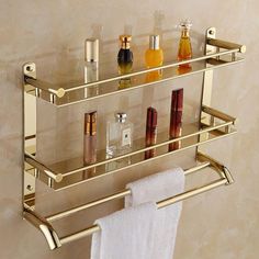 a bathroom shelf that has some bottles on it