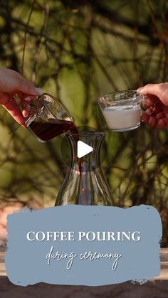 two hands are pouring coffee into a pitcher