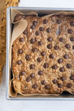 an oatmeal cookie with chocolate chips in a pan