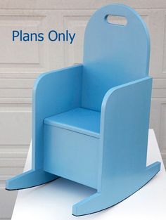 a blue plastic chair sitting on top of a white table