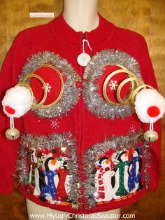 a red sweater with christmas decorations on it