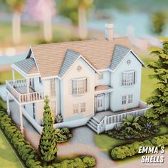 a model of a house with trees and bushes around it