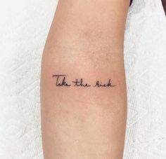 a woman's arm with the words take the rest tattooed on it