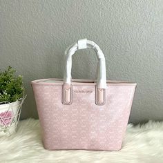 Michael Kors Jodie Small Logo Jacquard Powder Blush Signature Tote Bag $348. Nwt Michael Kors Jodie Small Logo Jacquard Tote Bag 35h1t2jt1c Retail: $348 Color: Powder Blush Sealed In Manufactory Package Product Details: Tote Bag Logo Jacquard 100% Recycled Polyester 11.5”W X 8h X 4.75”D Handle Drop: 5” Lining: 60% Polyurethane/40% Recycled Polyester Open Top Imported Feminine Michael Kors Travel Bags, Designer Blush Bags For Shopping, Michael Kors Designer Blush Bags, Designer Michael Kors Blush Bag, Feminine Bags With Branded Hardware, Bag Logo, Laptop Tote Bag, Bucket Tote, Michael Kors Tote Bags