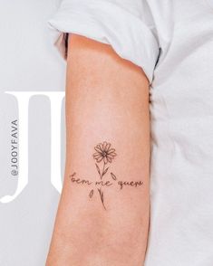 a woman's arm with a small flower on it and the words been me gone written in cursive font