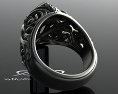 "\"Corvus Omnia Marquise\" Everything, forever. Meet Omnia, an airy ring with some heavy weight. Your engagement ring should be perfectly balanced for comfort, fit, style, and durability. On these points Omnia delivers. The Embraced Scrolls motif from our Corvus Collection created in a gently darkened and satin finished grey gold create the fully sculpted three-dimensional upper gallery for this amazing ring. Sculpted metal and negative space allow light and shadow to play across your hand thoug Elegant Formal Rings With Antique Finish, Elegant Antique Finish Rings For Formal Occasions, Elegant Antique Finish Wedding Rings, Gothic Anniversary Ring With Intricate Design, Handmade Elegant Skull Ring, Steampunk Round Jewelry For Formal Occasions, Steampunk Style Round Jewelry For Formal Occasions, Formal Steampunk Round Jewelry, Black Gold Engagement Ring