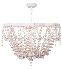 a chandelier with white shells hanging from it's center piece and beads on the bottom