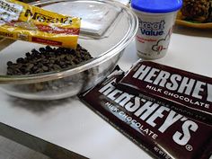 there are chocolate bars, milkshake and ice cream on the table with other snacks