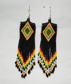 Multicolor Earrings With Black Beads, Traditional Adjustable Beaded Earrings, Multicolor Earrings With Black Beads For Gift, Traditional Black Beaded Earrings, Multicolor Traditional Beaded Earrings, Traditional Black Earrings With Large Beads, Bohemian Multicolor Beaded Earrings With Black Beads, Traditional Black Beaded Dangle Earrings, Traditional Black Dangle Beads