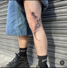 a man with a tattoo on his leg