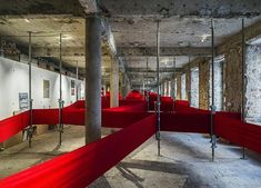 an empty room with red cloth covering the floor