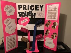 a display with pink and black items for pricey posh on the front wall