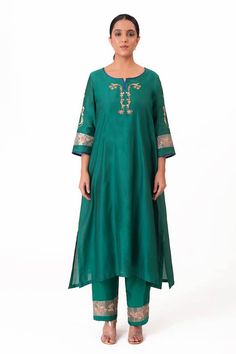 Emerald green A-line kurta with embroidery along the neckline and sleeves. Paired with a pant and tissue applique work dupatta. - Aza Fashions Traditional Anarkali Set With Embroidered Neckline For Eid, Eid Anarkali Set With Embroidered Neckline, Traditional Eid Anarkali Set With Embroidered Neckline, Chanderi Straight Kurta Set With Embroidered Neckline, Green Cotton Silk Kurta With Embroidered Border, Green Silk Churidar With Embroidered Border, Green Silk Anarkali Set With Embroidered Border, Green Silk Embroidered Churidar, Bollywood Style Festive Palazzo Set With Embroidered Neckline