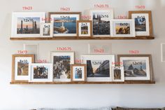 a living room with pictures on the wall and numbers hanging from it's shelves