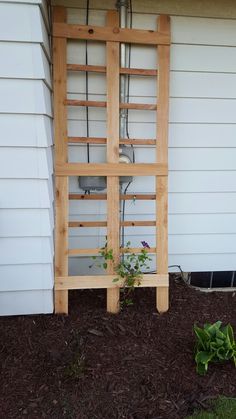 a planter is attached to the side of a house