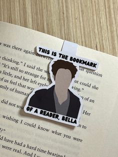 a bookmark with the words, this is the bookmark of a reader,bella