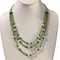 This Is A Gorgeous Natural Peridot, Dyed Green Agate, And Man-Made Pearl Bead Necklace. It Looks Beautiful On The Neck. Measures 21 Inches Long With A One Inch Extender To Make It Go Up To 22 Inches. The Clasp Is Made Of A Silver Tone Base Metal. In Unused Vintage Condition. Green Multi-strand Necklace With Natural Stones, Pearl Bead Necklace, Peridot Green, Green Agate, Go Up, One Inch, Base Metal, Bead Necklace, Pearl Beads