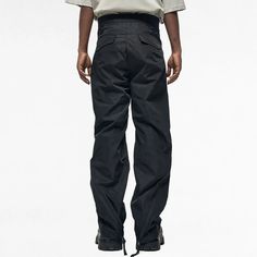 Relaxed-fit Flared hem Integrated press-release belt Zip expansion panel at legs Snap closure with zip fly Zippered hand pockets Darts at knees 4-Pocket construction Zippered hand pockets Flap pockets at back Composition: 100% PolyesterProduct Style Code: M10945-157 Functional Cargo Pants For Streetwear With Belt Loops, Combat Bottoms With Belt Loops For Outdoor Activities, Winter Bottoms For Outdoor Activities With Multiple Pockets, Streetwear Full-length Work Pants With Multiple Pockets, Streetwear Work Pants With Multiple Pockets, Full Length Work Pants With Multiple Pockets For Streetwear, Winter Pants With Multiple Pockets, Solid Techwear Pants With Hip Pockets, Solid Color Pants With Patch Pockets For Streetwear