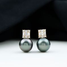 Product Details The fabulous Tahitian Pearl Simple Stud Earrings will make you the showstopper at your events and fill your day with heart-melting compliments. Embellished with a Round Shape Tahitian Pearl while Baguette and Round Shape Diamonds secured in Illusion Setting, embrace the phenomenal design. These Tahitian Pearl Earrings are an incredible choice to accentuate your look at your special events. Product Information SKU SHP-EARRINGS102026312 Width 10 mm Height 10.5 mm Weight 1.92 gm (Ap Minimal Stud Earrings, Minimal Earrings Studs, Tahitian Pearl Earrings, Black Pearl Earrings, Tahitian Black Pearls, Simple Stud Earrings, Minimal Earrings, Pearl And Diamond Earrings, June Birthstone