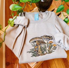 Follow @lebeaudenimco on Instagram to be the first to know about size restocks! Say hello to your new favorite sweatshirt! This cozy crew is designed, digitized, & stitched in our northern Virginia based studio.  * Each crew neck is made to order based on size of your choice. They are already dyed. Please allow up to 14 days to be completed and shipped out. * Please reach out prior to purchase for custom requests. These requests can include size, style, or sweatshirt color. Please note that these requests may cause an increase in price or completion time. I am happy to accommodate need by dates as long as I hear from you prior to purchasing the item. Material: - 50% Cotton, 50% Polyester - All hoodies and crewneck sweatshirts are fleece. Care instructions: - Machine cold wash, inside out, Fall Cotton T-shirt With Floral Embroidery, Winter Cotton Tops With Embroidered Patch, Winter Cotton Top With Embroidered Patch, Winter Long Sleeve Tops With Embroidered Patch, Embroidered Long Sleeve Winter Tops, Long Sleeve Tops With Embroidered Patch For Winter, Casual Embroidered Sweatshirt For Fall, Fall Cotton Sweatshirt With Embroidered Patch, Long Sleeve T-shirt With Machine Embroidery For Fall