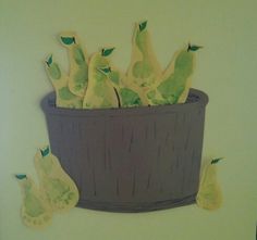 some pears are in a pot on the wall