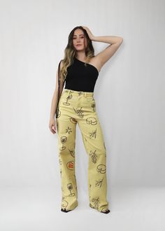 The iconic Cocktail Hour Pants, with a trendy yellow hue and playful sketches of cocktail hour snacks and drinks. Crafted from stretch material for a comfortable feel, these high waisted pants are a statement with an effortlessly cool vibe. *FINAL SALE ITEM* Material & Care: Made with a blend of 97% cotton and 3% spandex, offering a comfortable stretch and soft feel. Machine wash cold with like colors on a gentle cycle. Tumble dry low and cool iron if necessary. Avoid dry cleaning. Size & Fit: O High Waist Pants With Graphic Print For Spring, High Waist Graphic Print Pants For Spring, Trendy Yellow Straight Leg Bottoms, Spring High-waisted Pants With Graphic Print, Yellow Graphic Print Cotton Bottoms, Trendy Yellow Straight Leg Pants, Yellow Cotton Bottoms With Graphic Print, Yellow Printed Cotton Bottoms, Printed Yellow Cotton Bottoms