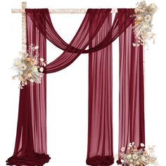 a red drape with flowers on the top and bottom is hanging in front of a white background