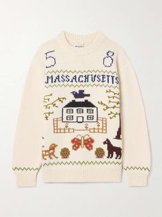 a white sweater with an image of a house and animals on it, the words massachusetts written