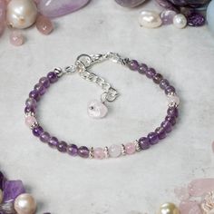 Amethyst and Rose Quartz bracelet designed and handcrafted with care and attention to detail using: AAA 4mm round Amethyst beads, AAA 4mm round Rose Quartz beads, Silver spacer beads. The bracelet is hand threaded onto quality 19 strand beading wire for flexibility and durability and measures 17cm + 3cm extender chain for an adjustable fit and is fastened using an quality silver plated lobster claw clasp. Amethyst is said to provide the wearer with emotional support, providing calmness serenity Amethyst And Rose Quartz, Heart Stone, Rose Quartz Bracelet, Rose Quartz Beads, Meaningful Jewelry, Bracelet Ideas, Quartz Beads, Pretty Bracelets, Beading Wire