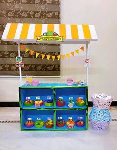 an outdoor stand with fruit and vegetables for sale