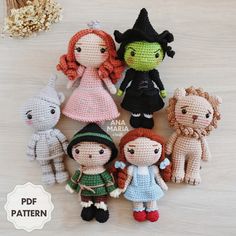 small crocheted dolls sitting on top of a table