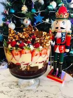 a christmas tree with a nutcracker dessert in front of it