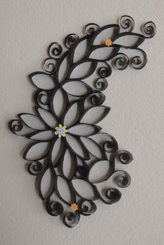 an intricately designed metal wall hanging on the wall