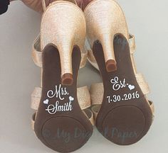 two brides shoes with their names on them