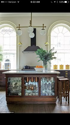 a kitchen with an island in the middle of it