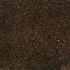 a close up view of a brown granite counter top