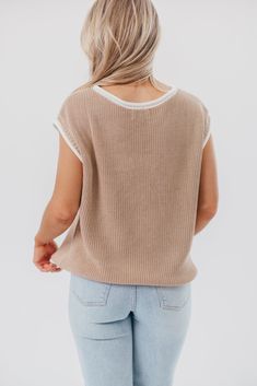 This is one of those must-have tops for dressing chic in warm weather. The Stella Sweater Vest Top features a charming, relaxed fit, paired with cap sleeves and contrast color binding; it's perfect for slipping on with linen pants, or pairing with your favorite denim. Best of all, it transitions beautifully between seasons! Available in two colorways. FIT: Runs true to size - relaxed fit. MATERIAL: 55% Acrylic, 45% Cotton. GARMENT DETAILS: Lightweight sweater knit top with a high rounded neckline, cap sleeves, and relaxed, boxy fit. Features rolled contrast binding. SIZE GUIDE: XS (0-2) / S (2-4) / M (6-8) / L (10-12) / XL (14-16) MODEL DETAILS: MISSES Mackenzie - Size S Heather - Size S Bust 34" 34" Waist 27.5" 27.5" Hips 40.5" 37.5" Height 5'7" 5'7" Beige Crew Neck Sweater Vest For Spring, Relaxed Fit Sweater Vest For Spring Layering, Spring Cotton Sweater Vest With Relaxed Fit, Everyday Beige Knit Sweater Vest, Beige Knit Sweater Vest For Everyday, Spring Knit Sweater Vest For Loungewear, Casual Knit Sweater Vest For Everyday, Casual Crew Neck Sweater Vest For Spring, Casual Sweater Vest For Everyday Spring Wear