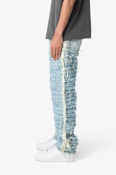 the V631 Allover Frayed Denims are designed with a baggy fit throughout, featuring a vintage wash, exposed and raw seams throughout, and finished off with raw hem. details relaxed fit* 100% cotton zipper at inseam model is 6’1, 140 lbs and wears a size 30 Distressed Dark Wash Rigid Denim Flare Jeans, Urban Ripped Cotton Jeans, Urban Style Ripped Cotton Jeans, Ripped Cotton Jeans For Streetwear, High Rise Distressed Cotton Jeans, Urban Style Distressed Denim Blue Flare Jeans, Urban Denim Blue Distressed Flare Jeans, Urban Distressed Denim Blue Flare Jeans, Distressed Blue Flare Jeans For Streetwear