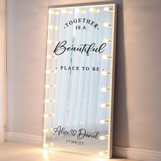 a lighted mirror with the words, together is a beautiful place to be on it