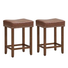 two brown leather stools side by side on a white background, one with studded legs and the other without