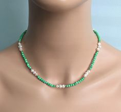 The necklace is made of 4 mm. green turquoise beads and adorn 6-7 mm freshwater pearl beads. A length is 17.5'' ( 42.5 cm. ). If you need another size please  let me know. The necklace will be packaged  in a gift box. The necklace is ready to ship. Thank you for visiting my shop. Green Single Strand Pearl Necklace With Round Beads, Green Pearl Necklace With Gemstone Beads, Green Pearl Necklace With Round Gemstone Beads, Green Round Beads Turquoise Necklace As Gift, Green Turquoise Necklace With Tiny Beads For Gift, Turquoise Necklace With Tiny Beads As A Gift, Green Turquoise Necklace With Tiny Beads As Gift, Green Turquoise Single Strand Necklace As Gift, Adjustable Green Pearl Necklace