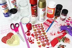 some crafting supplies are laying out on a white table with scissors and other items