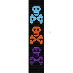 a cross stitch bracelet with three skulls and bones on it, one is purple and the other is blue